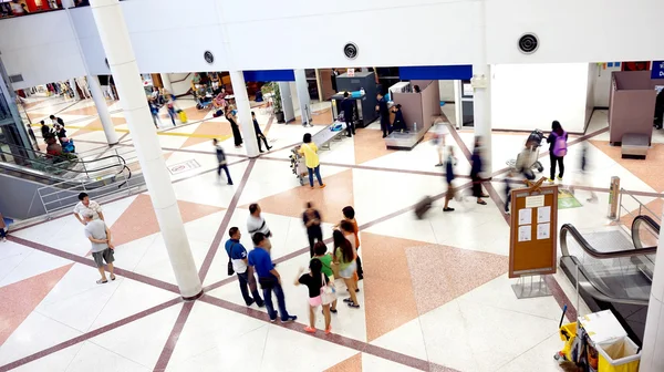 People at airport bag check gate