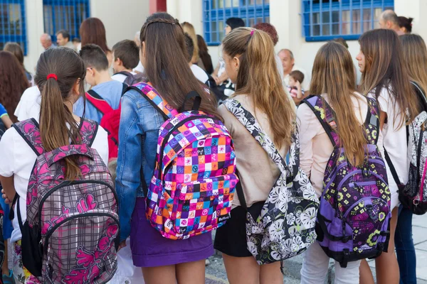 Students with their backpacks. First Day of school for the stude