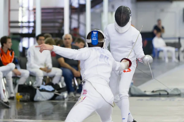 Young athletes competing during the World Youth Fencing Champion