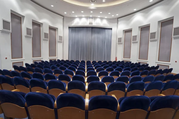 Empty blue seats for cinema, theater, conference or concert. The