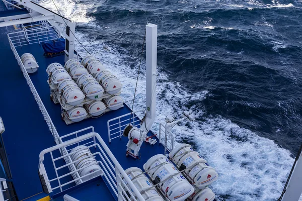 Barrels containing emergency liferafts on the ship, in Greece.