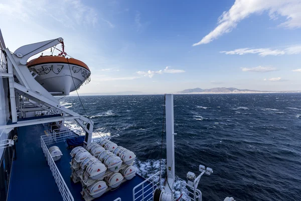 Barrels containing emergency liferafts on the ship, in Greece. R
