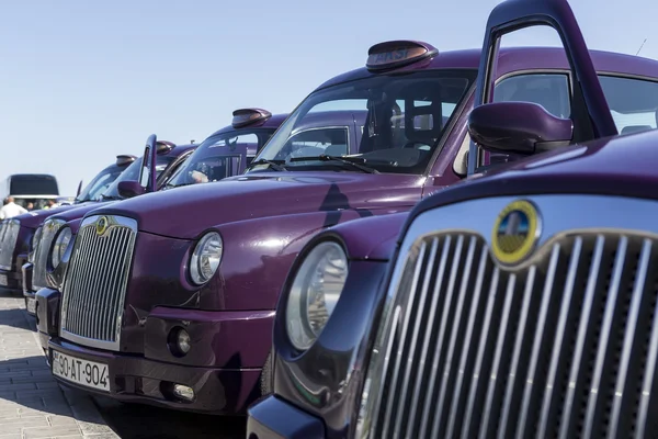 Local cabs waiting in line for passengers in Baku, Azerbaijan.