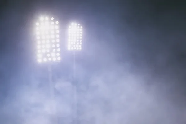 Stadium lights and smoke