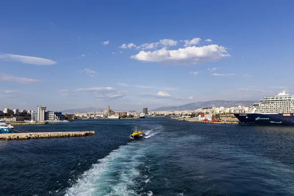 Ferry boats, cruise ships docking at the port of Piraeus, Greece