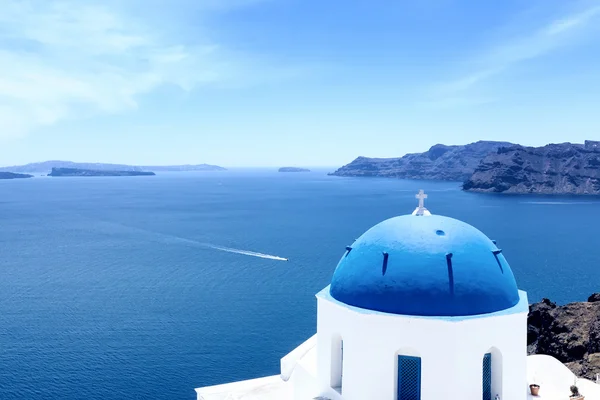 Blue domed churches on the Caldera at Oia on the Greek Island of