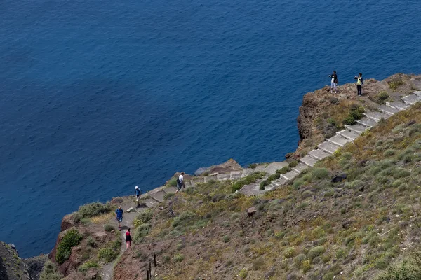 Tourists walking up the stairs to visit the church on the mounta