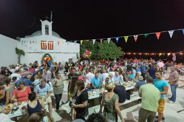 People are eating and celebrating at the big yearly festival in