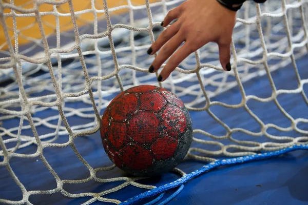Undefined hands holding a ball prior to the Greek Women Cup Fina