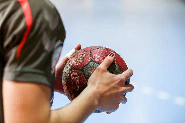 Undefined hands holding a ball prior to the Greek Women Cup Fina