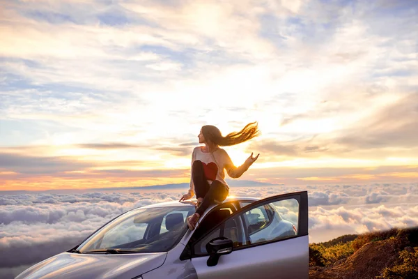 Woman enjoying beautiful cloudscape