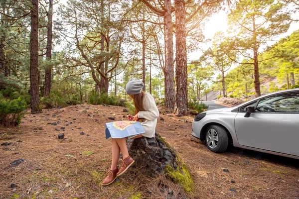 Woman Traveling by car in the forest