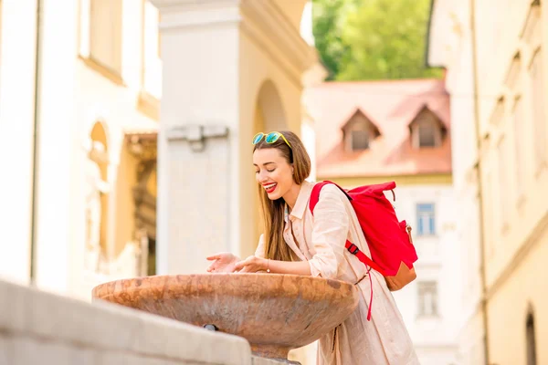 Woman near the fountain in Ljubljana city