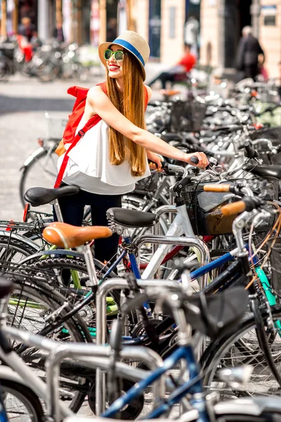 Woman with bicycle in the city