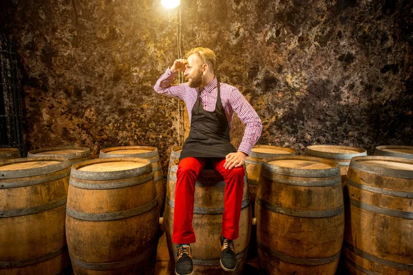 Portrait of a sommelier in the wine cellar