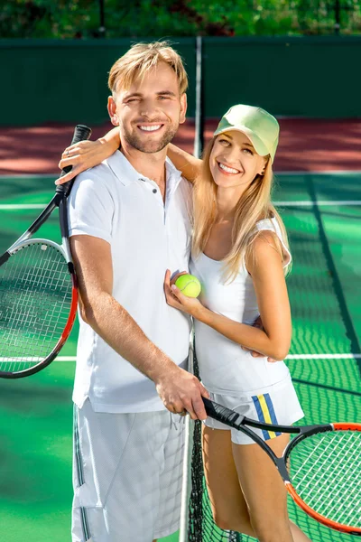 Young couple playing tennis