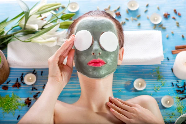 Woman with spa mask