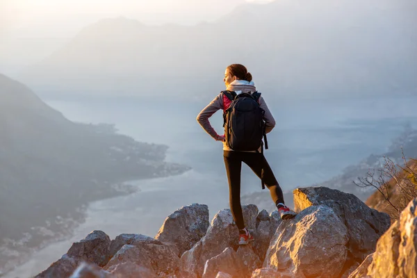 Young photographer on the top of mountain