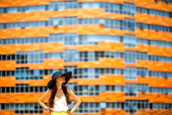 Woman on the contemporary facade background