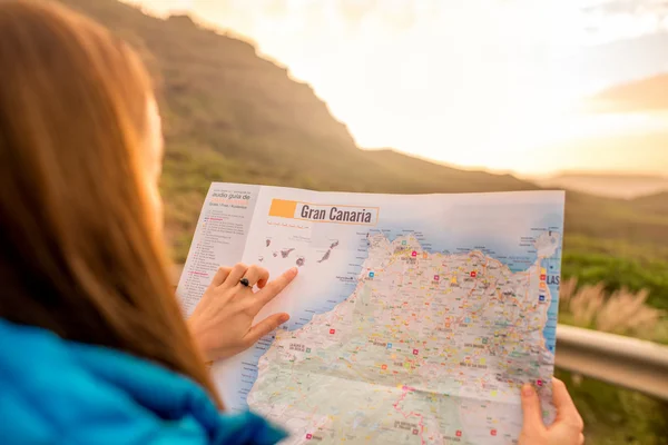 Woman pointing on the map of Gran Canaria island