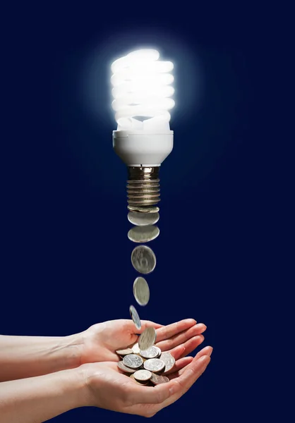 Concept saving money by using energy saver lamp