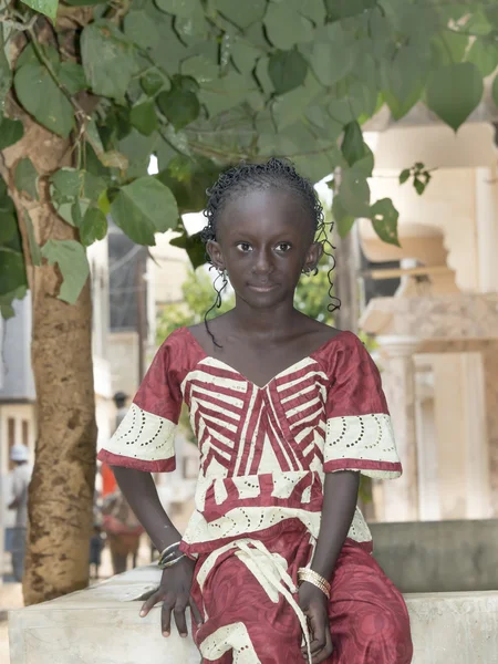 Editorial caption MBAO, SENEGAL, AFRICA, AUGUST 6, 2014, Child in the street on a feast day, popular district of Little MBao