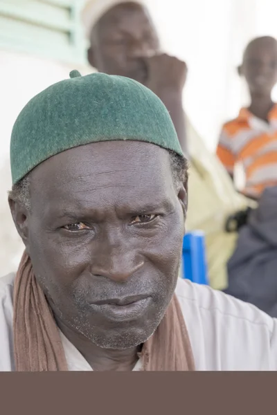 Thiaroye, Senegal, Africa, July 18, 2014, Unidentified Muslim men sitting in front of the Grand Mosque