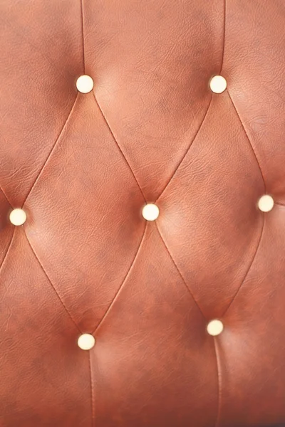 Texture of vintage brown leather sofa for background