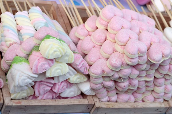 Marshmallow different colorful on sticks.
