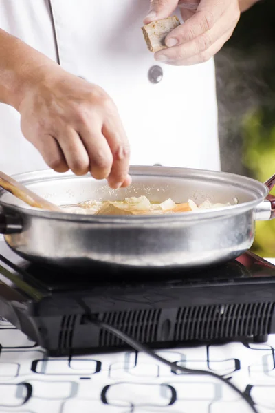 Chef putting Japanese curry paste for cooking