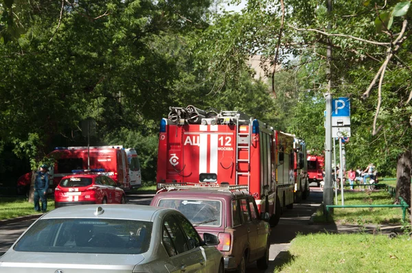 Fire in apartment building, fire engines