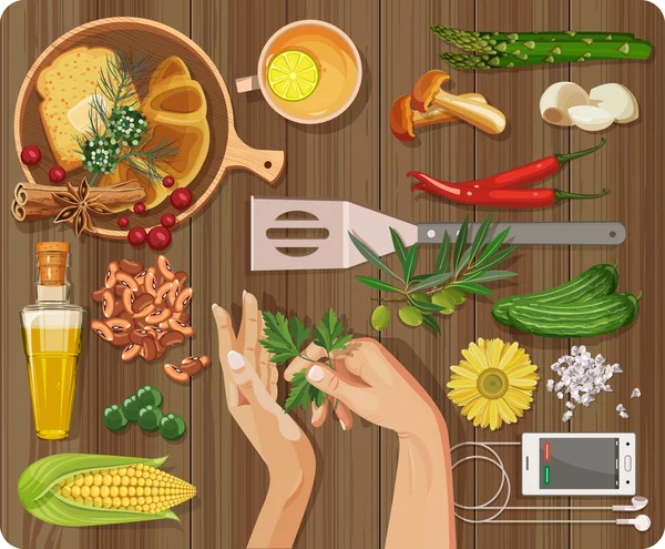 Workplace concept. Top view with textured table, plates, dishes, pepper, garlic, asparagus, mushrooms, berries, green peas, corn, salt, spices, cooking utensils, rolls, croissants, olive oil