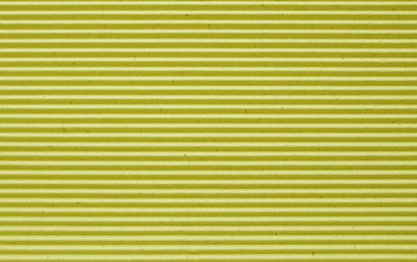 Yellow corrugated paper background.