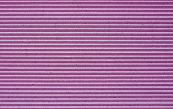 Purple corrugated paper background.