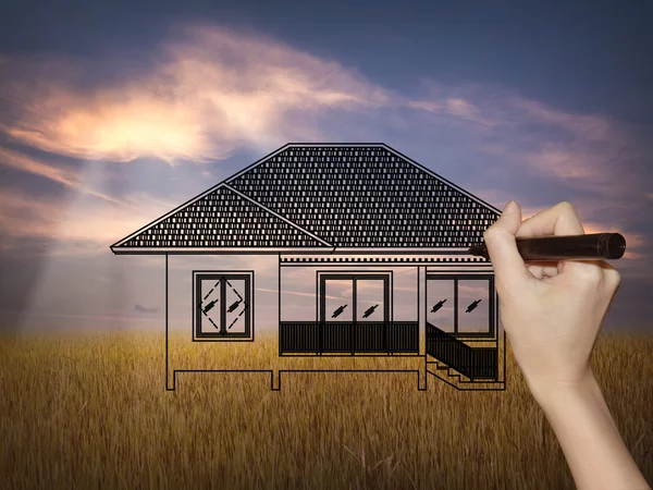 Drawing a dream home on nature background