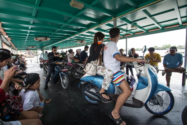 SAMUTPRAKARN - AUGUST 29:passengers with motercycle on passenger liner in Chao Phraya river on August 29, 2015  in Samutprakarn, Thailand.