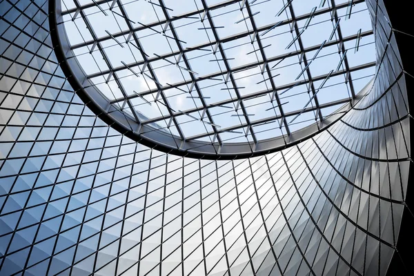 Architecture blue glass ceiling inside contemporary business hal