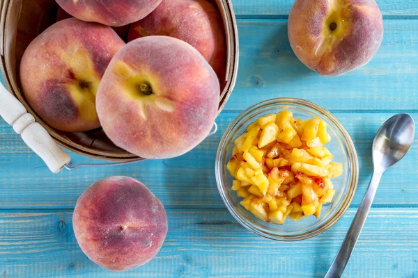 Fresh organic yellow peaches and peach salsa