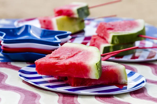 Watermelon on a stick at picnic