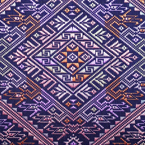 Colorful thai silk handcraft peruvian style rug surface old vintage torn conservation Made from natural materials Chemical free close up silk background silk texture