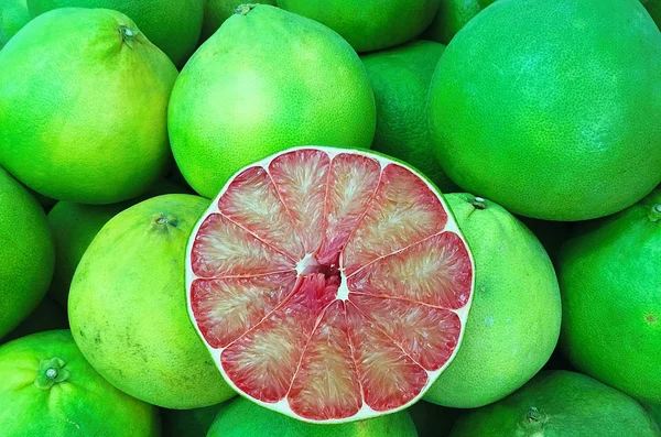 Fresh Red Grapefruit Slice On Grapefruit organic cut background