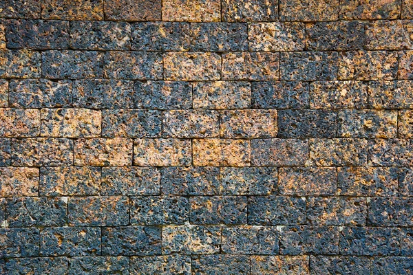 Pattern brown color of modern style design decorative uneven cracked real stone wall home surface with cement