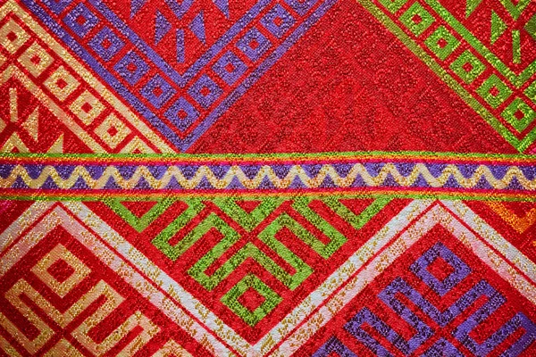 Colorful thai handcraft peruvian style rug surface close up. More of this motif & more textiles peruvian stripe beautiful background tapestry persian nomad detail pattern arabic fashionable textile.