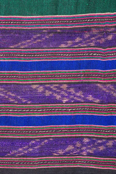 Colorful thai silk handcraft peruvian style rug surface close up More this motif & more textiles peruvian stripe beautiful background tapestry persian nomad detail pattern farabic fashionable textile.