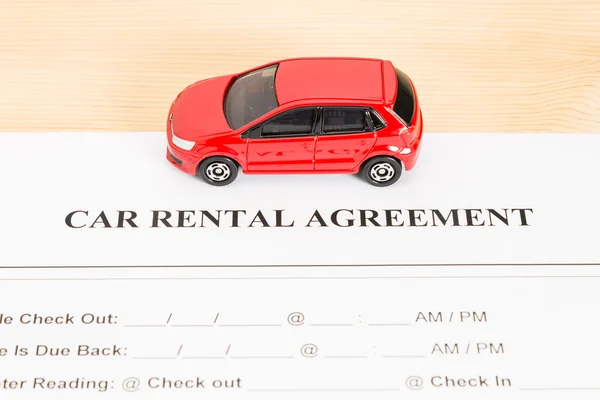 Car Rental Agreement With Red Car on Center