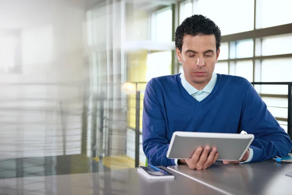 Middle eastern descent businessman looking at an architecture model