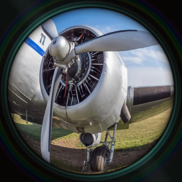 Old airplane engine in objective lens