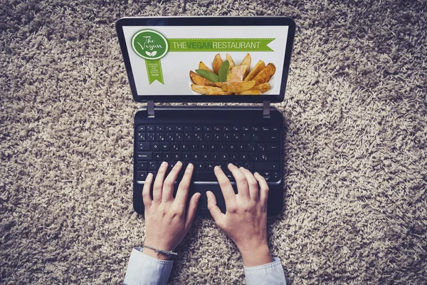 Vegan restaurant website in a laptop computer. Booking restauran