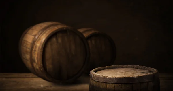 Red wine with barrel on vineyard in green Tuscany, Italy