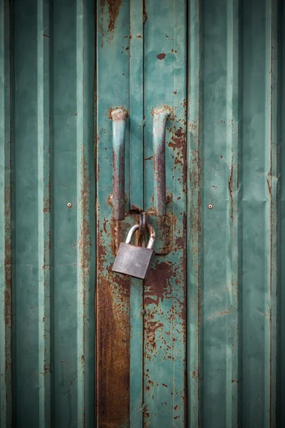 Grunge green door lock with key